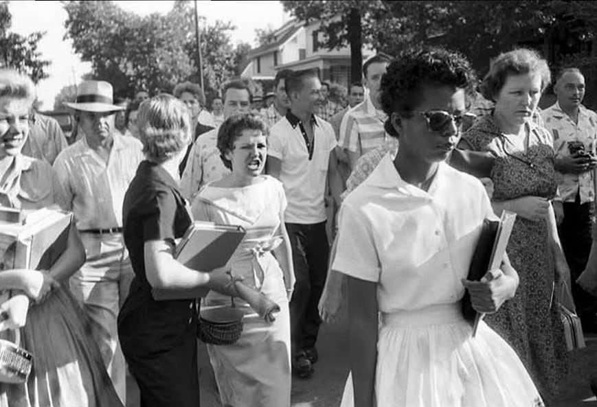 One of the "Little Rock Nine" braves a jeering crowd.