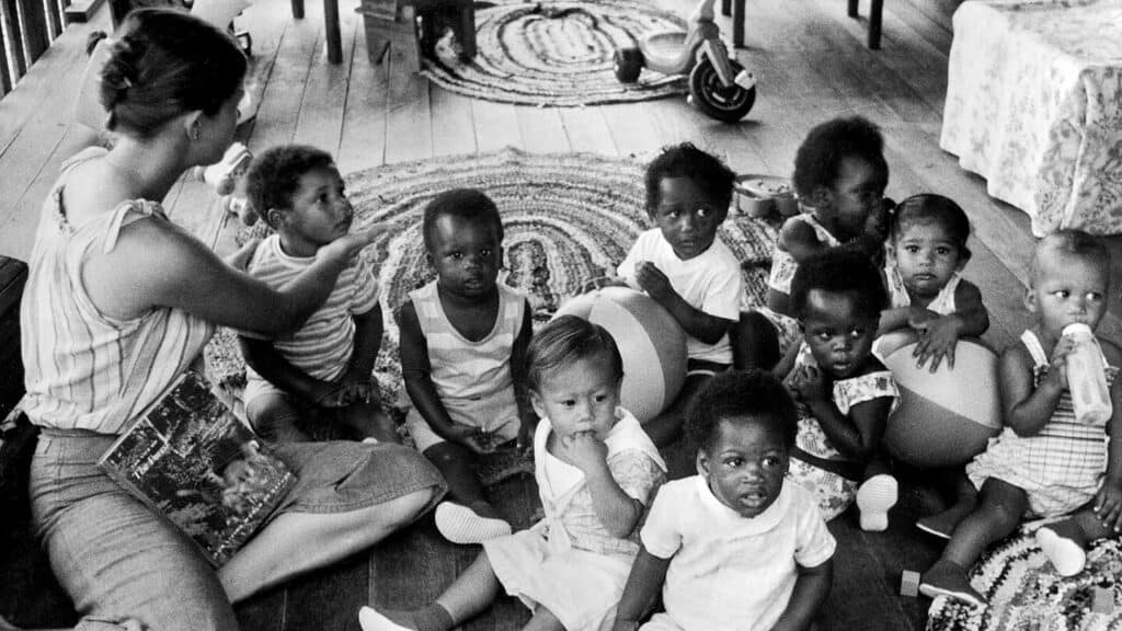 A Peoples Temple member with children in the Nursery of the sectin 1978. (AFP/Getty Images)
